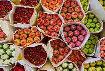 Beautiful bouquets of mixed flowers in a flower shop. A bright mix of flowers. Background on full screen. Handsome fresh bouquets. Flowers delivery. Floral shop concept . Selective focus.