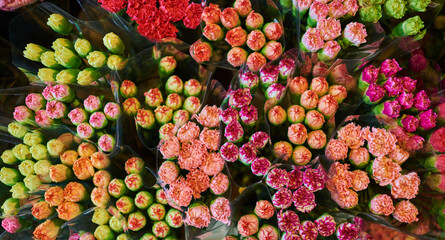 Beautiful bouquets of mixed flowers in a flower shop. A bright mix of flowers. Background on full screen. Handsome fresh bouquets. Flowers delivery. Floral shop concept .