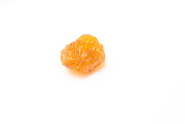 Close up of raisins on a white background