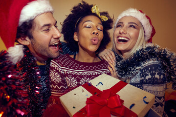 Group of happy friends celebrating New Year together