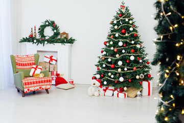 Christmas tree with fireplace presents the decor of the house New Year