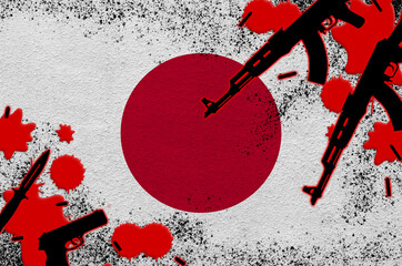 Japan flag and guns in red blood. Concept for terror attack and military operations