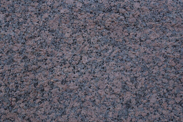 Granite texture, background. Hewn granite stone.