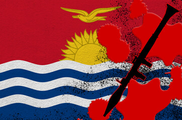 Kiribati flag and black RPG-7 rocket-propelled grenade launcher in red blood. Concept for terror attack or military operations with lethal outcome