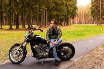 Obraz na płótnie Canvas Beautiful young man, road, motorcycle