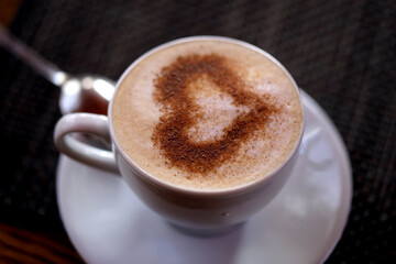 Photo of delicious coffee with a heart pattern cappuccino