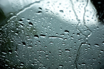 Water drops on the window pane
Rain drops on the windscreen, rainy day 
