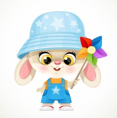 Cute little bunny boy rabbit in panama hat plays with a multi-colored turntable isolated on white background