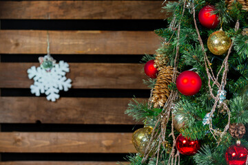 Fototapeta na wymiar Christmas tree with decorations and colorful light bulbs