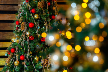 Christmas tree with decorations and colorful light bulbs