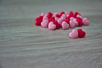 red hearts on a wooden background