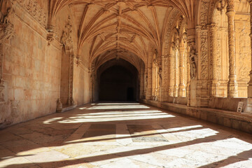 Archway of an old monastery. Cloisters of Jeronimos Monastery. Lisbon Portugal	