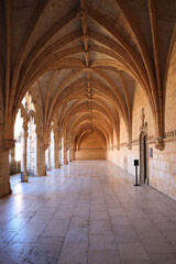 Fototapeta na wymiar Archway of an old monastery. Cloisters of Jeronimos Monastery. Lisbon Portugal