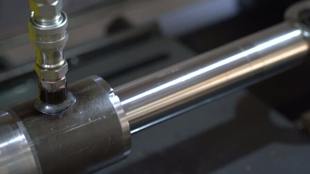 Production line of hydraulic shock absorber.  
Hydraulic shock absorber works. Close up view.