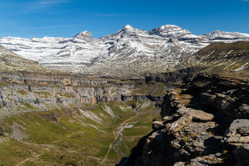 Views from Cuello Gordo of Ordesa National Park with the Horsetail waterfall and peaks of Monte Perdido, Añisclo, Punta Olas, Cilindro del Marbore snow-capped on a summer day in the Aragonese Pyrenees