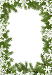 Christmas frame made of fir tree branches and white snowflakes isolated on white background