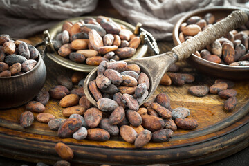 Cocoa beans on an old background.