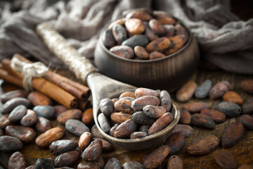 Cocoa beans on an old background.
