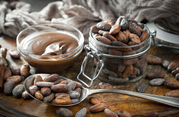 Cocoa beans on an old background.