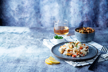 Mussel rice with pepper and parsley in a plate