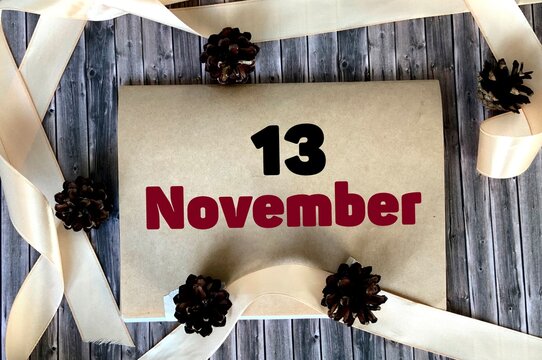 November 13 on craft paper on a wooden background.Autumn .Calendar for November.