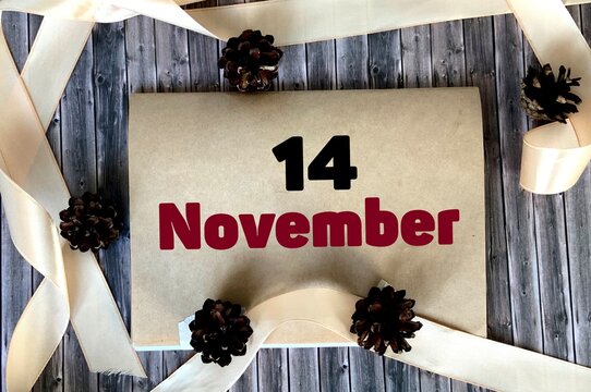 November 14 on craft paper on a wooden background.Autumn .Calendar for November.