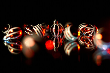 red and white christmas balls with black background and blue lights. Christmas print with black background and reflections. minimalist christmas photography