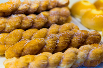 Freshly baked sweet pastries or bread rolls at the street market