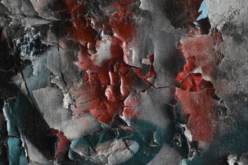 Colorful abstract background formed by chipped paint on a concrete wall.