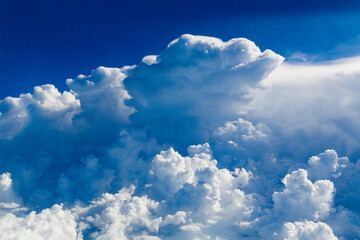 Naklejka na ściany i meble Cloud that looks like a dragon's head aerial view from an airplane window