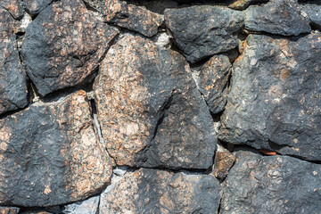 Fragment of a stone wall.