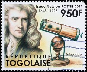 Isaac Newton and his telescope on stamp of Togo