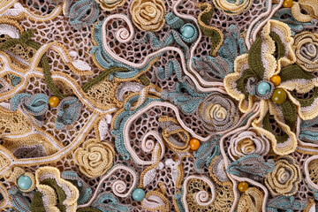 Crochet knitting. Lace of flowers.  Handmade Irish lace as a background