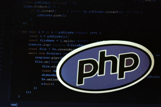 Moscow, Russia - 1 June 2020: PHP logo sign with program code on background Illustrative Editorial