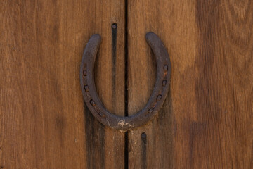 Centered horseshoe on wooden wall