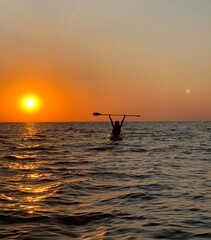 sunrise kayaking person