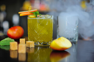 The cocktail is beautiful, delicious with lime, mint and ice in a glass