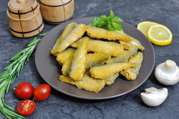Delicious fried fish in batter on a plate in a restaurant