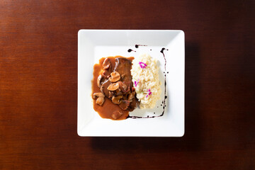 meat with champignon sauce and rice