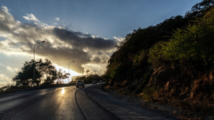 sunset over the mountains road