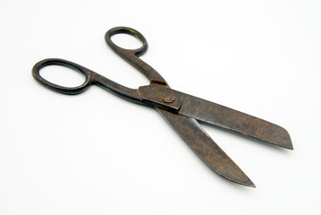 Old tailor scissors on a white background.