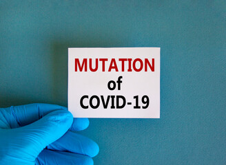 Hand in blue glove with white card. Concept words 'mutation of COVID-19'. Medical and COVID-19...