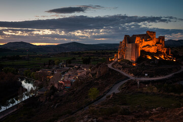 Obraz premium Beautiful city landscape of Zorita del los Canes with the village, Castle and Tagus river at sunset, Guadalajara, Spain