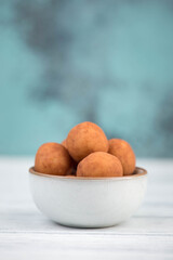 Marzipan potatoes, in german called Marzipankartoffeln, with cacao powder, sweets for christmas, empty copy space