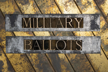 Military Ballots text message on textured grunge copper and vintage gold background
