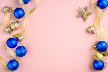 New Year's content with beautiful blue and gold balls for the Christmas tree, gold ribbon. A place for text.