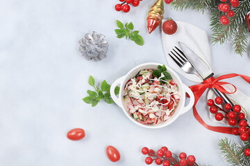 Christmas new year dishes, detox diet concept, traditional festive vegetable salad of cucumber, tomato and radish, healthy lifestyle and wholesome food concept, selective focus