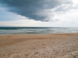 Fototapeta na wymiar beach with rain clouds