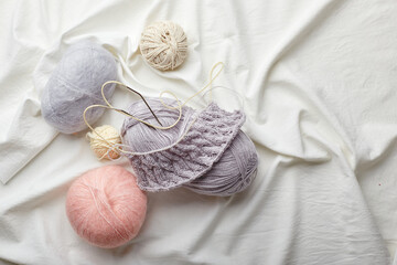 Fototapeta na wymiar Balls of wool and mohair for knitting in pastel colors