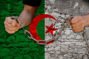 male hands breaking the iron chain, symbol of tyranny, protest against the background of the state...